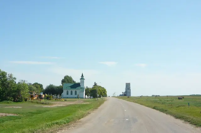 Railway Avenue with church and grain elevator
